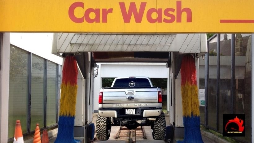 Lifted truck in a carwash